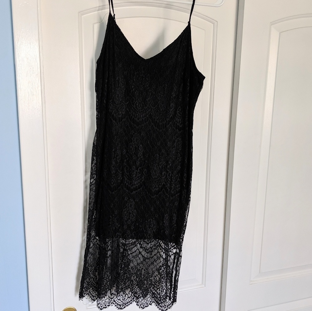 Lace form fitting black dress. Size Medium.